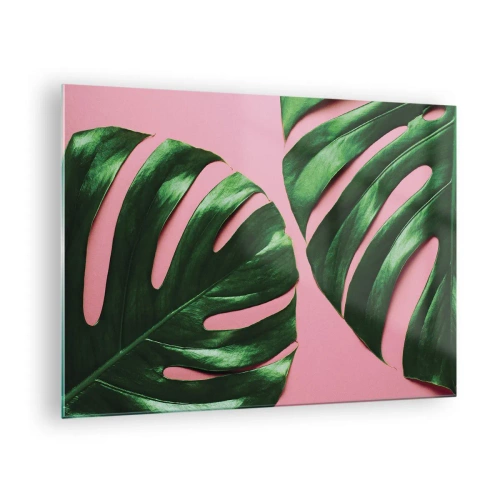 Quadro em vidro - Folhas verdes de monstera em um fundo rosa - 70x50cm - Encontro verde - Decoração de parede moderna para a sala de estar e quarto ARTTOR