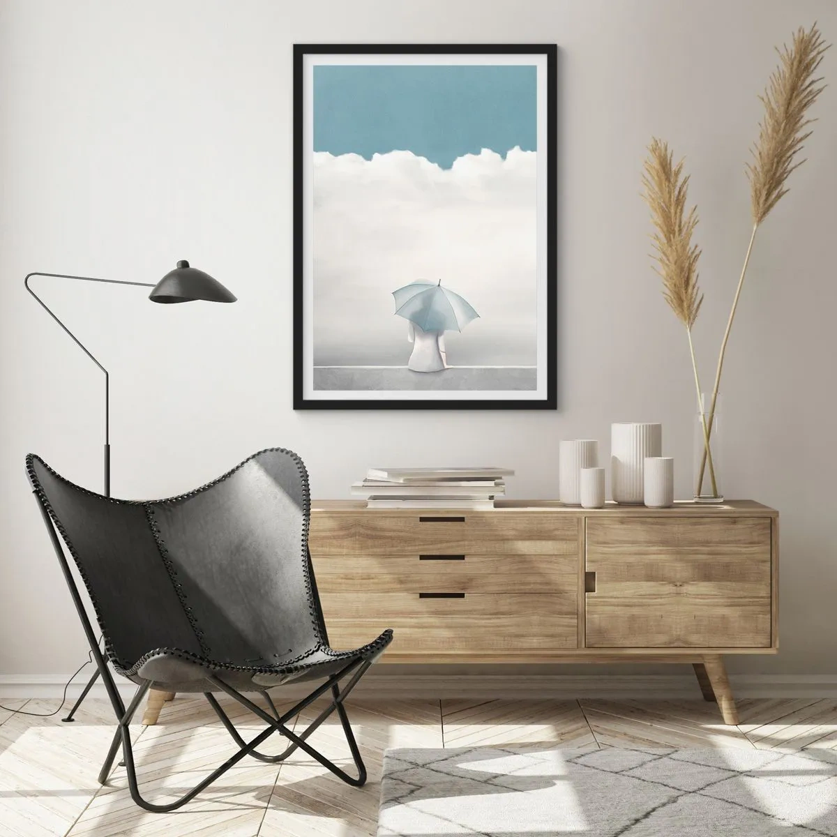 Pôster com moldura preta - Uma figura com um guarda-chuva sentada em uma saliência entre as nuvens - 50x70cm - No limite da realidade e dos sonhos - Decoração de parede moderna para a sala de estar e quarto ARTTOR