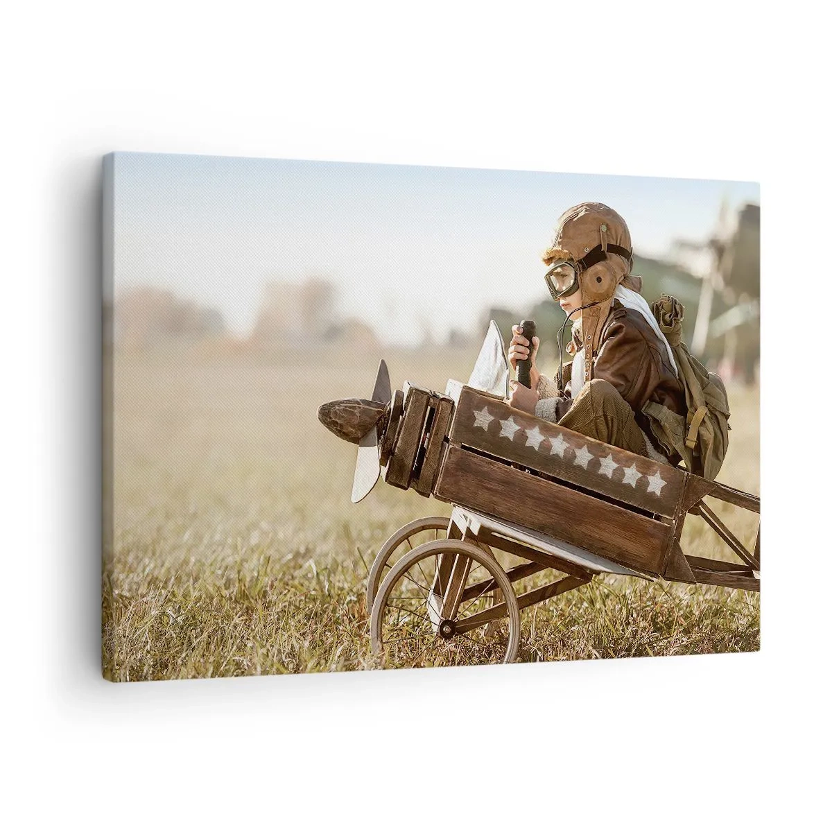 Quadro em tela - Uma criança em um avião de brinquedo com um campo ao fundo - 70x50cm - O início rumo a um sonho - Decoração de parede moderna para a sala de estar e quarto ARTTOR