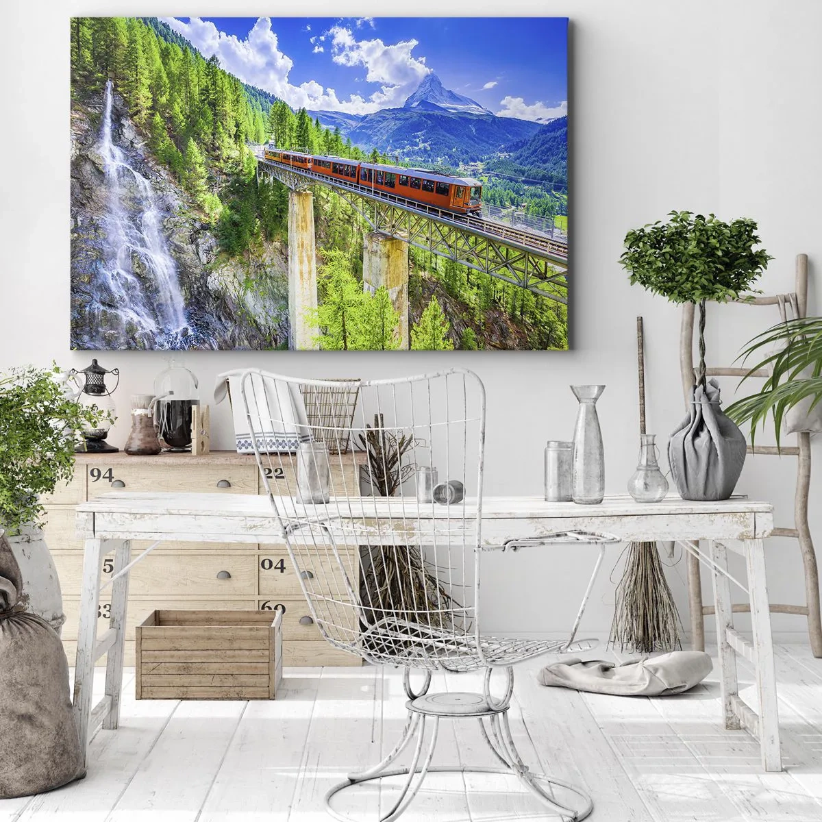 Quadro em tela - Uma montanha-russa em uma ponte com vista para uma cachoeira e montanhas - 70x50cm - Hora dos Alpes - Decoração de parede moderna para a sala de estar e quarto ARTTOR