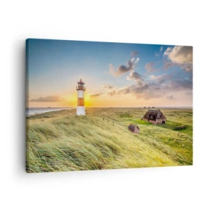 Quadro em tela - Um farol com prados e casas ao sol ao fundo - 70x50cm - Entre as ondas - Decoração de parede moderna para a sala de estar e quarto ARTTOR