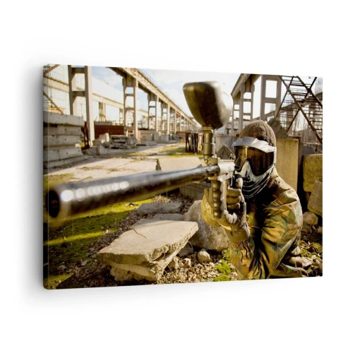 Quadro em tela - Um jogador de paintball com equipamento camuflado mirando um marcador - 70x50cm - Você também pode ser um herói - Decoração de parede moderna para a sala de estar e quarto ARTTOR